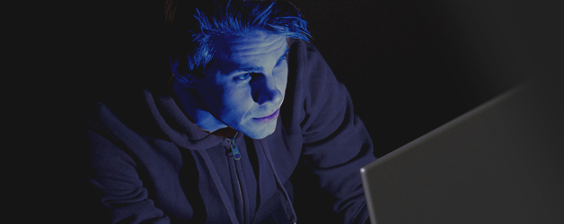 man infront of a computer